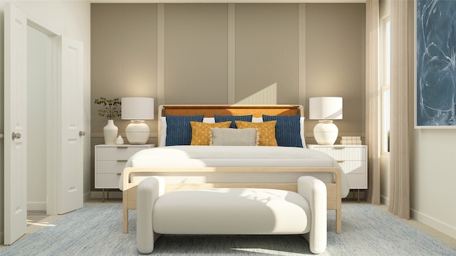 bedroom featuring baseboards and radiator
