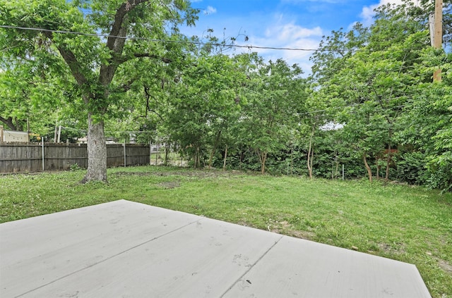 7734 Bruton Rd, Dallas, TX 75217 - view of yard featuring fence and a patio area
