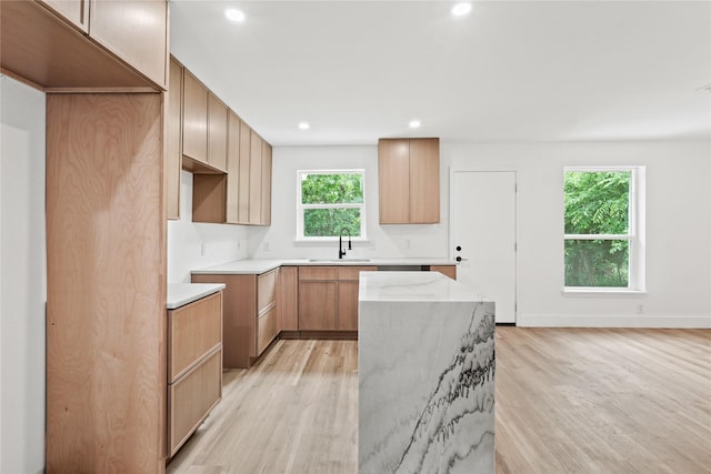 7734 Bruton Rd, Dallas, TX 75217 - kitchen with recessed lighting, a sink, light wood finished floors, and a center island