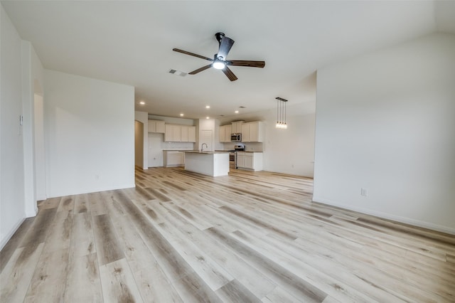 unfurnished living room with a ceiling fan, recessed lighting, light wood-style flooring, and visible vents