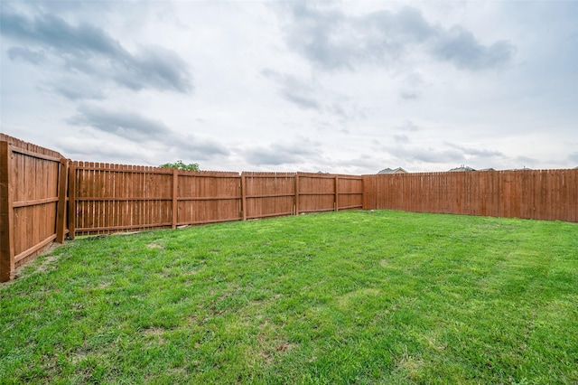 view of yard featuring a fenced backyard