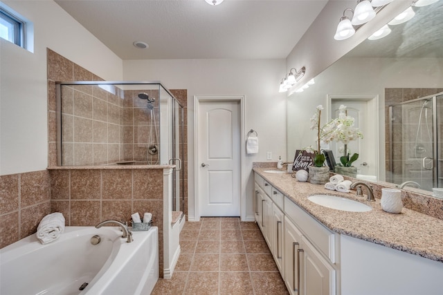217 Brick Row Dr, Richardson, TX 75081 - full bathroom with a sink, a bath, and a stall shower