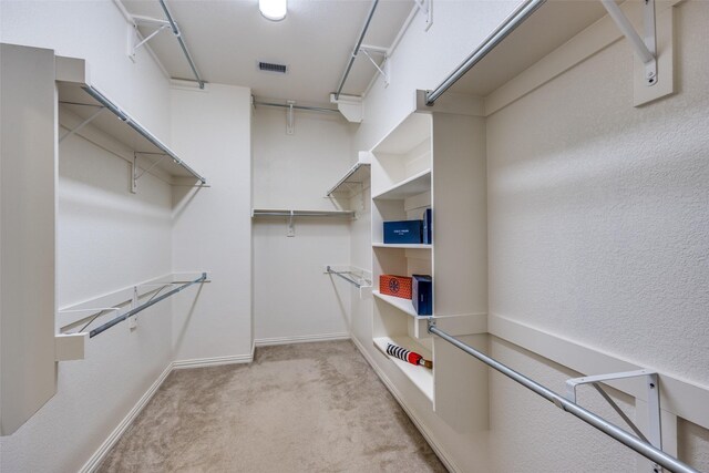 217 Brick Row Dr, Richardson, TX 75081 - spacious closet featuring visible vents and carpet