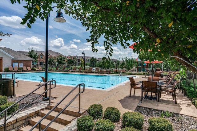 217 Brick Row Dr, Richardson, TX 75081 - community pool featuring a patio and fence