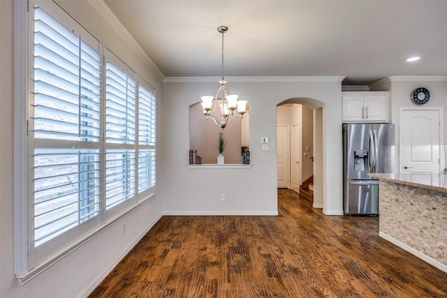 217 Brick Row Dr, Richardson, TX 75081 - unfurnished dining area with arched walkways, ornamental molding, dark wood-style floors, and a notable chandelier