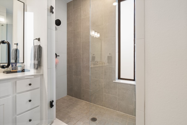 full bathroom featuring vanity and a stall shower