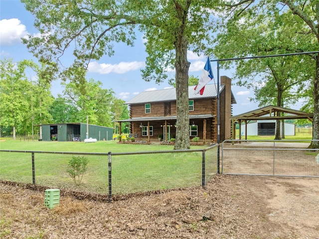 view of front facade featuring fence, log exterior, metal roof, and a front yard