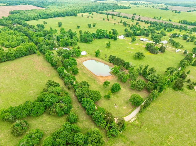 birds eye view of property with a rural view