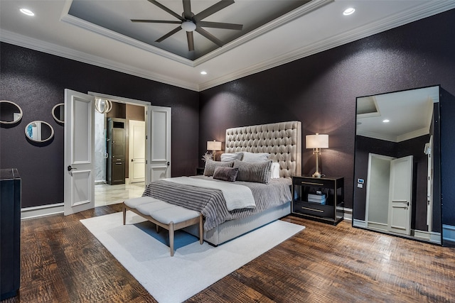bedroom with baseboards, ornamental molding, a textured wall, and wood finished floors