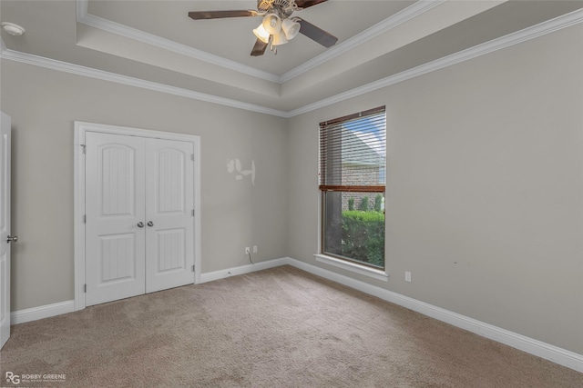 206 Jamestowne Blvd, Benton, LA 71006 - unfurnished bedroom with crown molding, carpet, a raised ceiling, and a closet