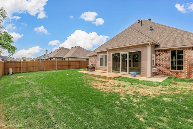 206 Jamestowne Blvd, Benton, LA 71006 - back of property with a fenced backyard, a wooden deck, a yard, and a shingled roof