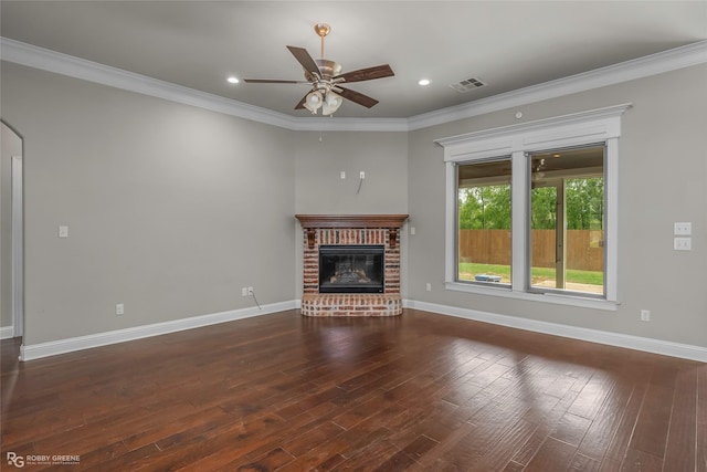 206 Jamestowne Blvd, Benton, LA 71006 - unfurnished living room with visible vents, wood-type flooring, ornamental molding, a brick fireplace, and a ceiling fan