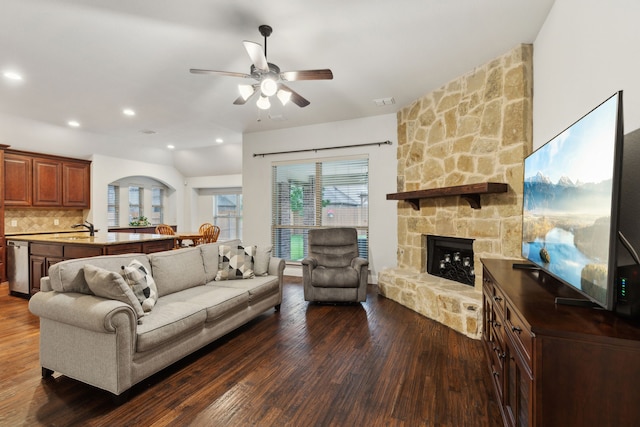 4324 Ashburn Way, Fort Worth, TX 76244 - living area with dark wood-type flooring, a ceiling fan, a stone fireplace, and recessed lighting