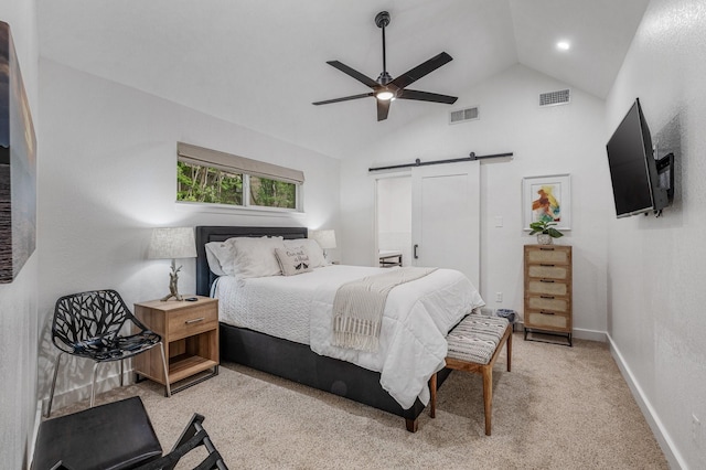 bedroom featuring visible vents, a barn door, baseboards, and a ceiling fan