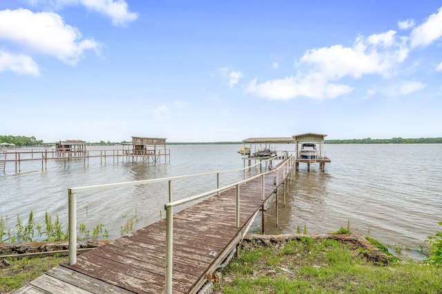view of dock featuring a water view and boat lift
