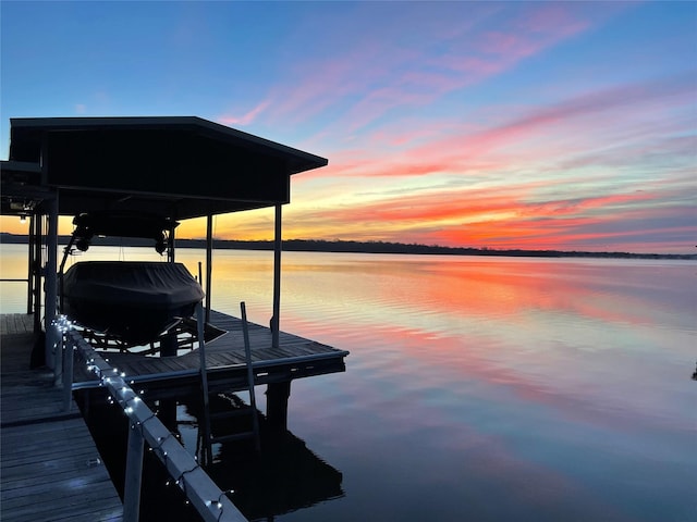 view of dock featuring a water view and boat lift