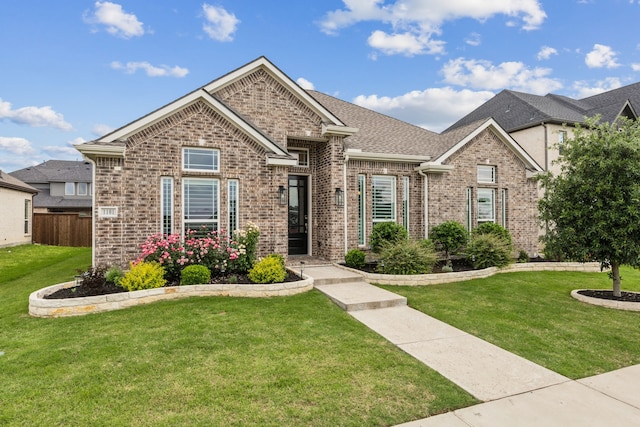 1101 Helmsley Dr, Frisco, TX 75036 - single story home with brick siding, a shingled roof, fence, and a front yard