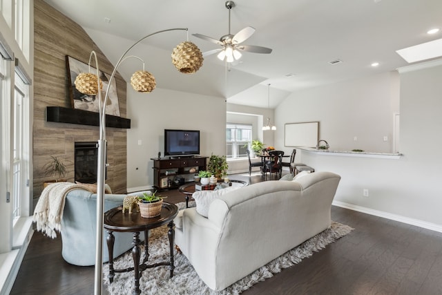 1101 Helmsley Dr, Frisco, TX 75036 - living room with baseboards, a fireplace, vaulted ceiling, and dark wood finished floors