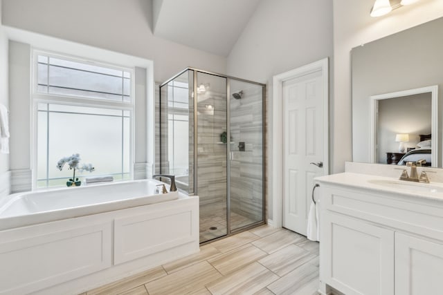 1101 Helmsley Dr, Frisco, TX 75036 - bathroom featuring vaulted ceiling, a shower stall, ensuite bath, and a garden tub