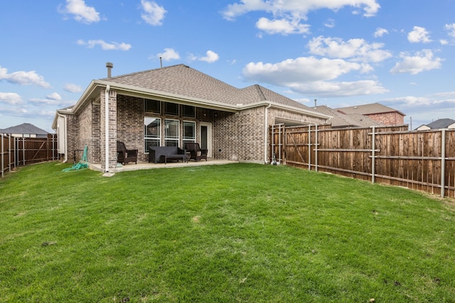 1101 Helmsley Dr, Frisco, TX 75036 - rear view of house featuring a shingled roof, brick siding, a fenced backyard, a patio area, and a yard