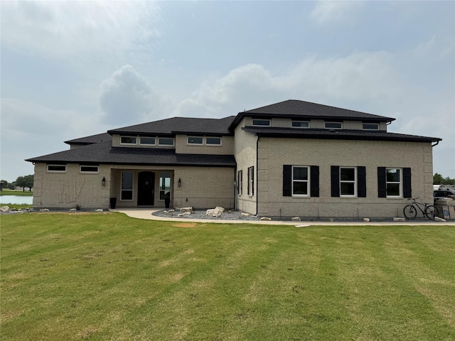 506 Calm Water Cv, Princeton, TX 75407 - rear view of house with a lawn