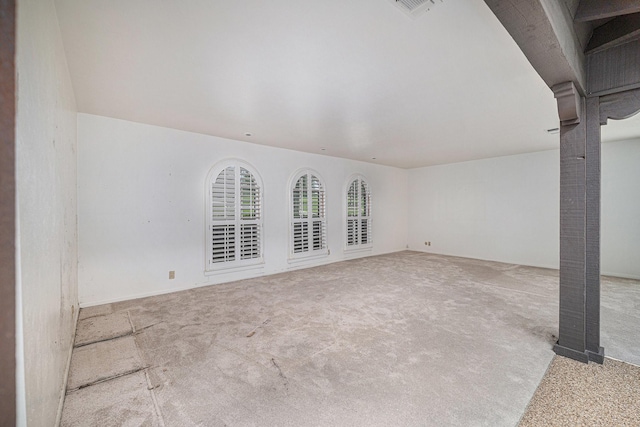 unfurnished living room featuring carpet flooring and visible vents