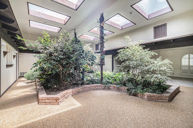 surrounding community featuring a skylight