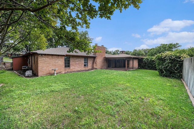 view of yard with a fenced backyard and a patio area
