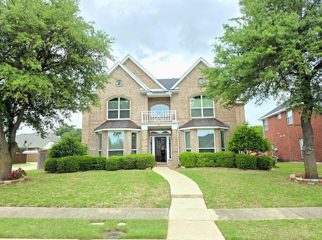 315 Melshire St, Sunnyvale, TX 75182 - traditional-style house with brick siding and a front yard