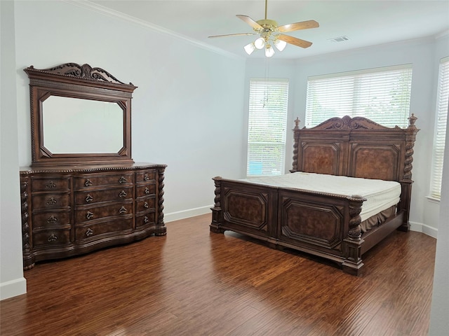 bedroom featuring baseboards, dark wood-style flooring, and visible vents