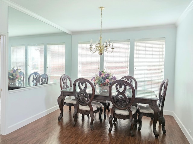 dining room featuring baseboards, an inviting chandelier, plenty of natural light, and wood finished floors