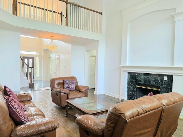 living area featuring a high ceiling and wood finished floors
