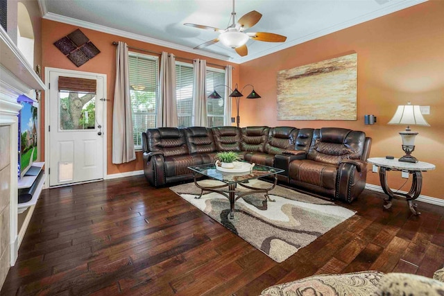 living area with baseboards, wood-type flooring, a ceiling fan, and a wealth of natural light