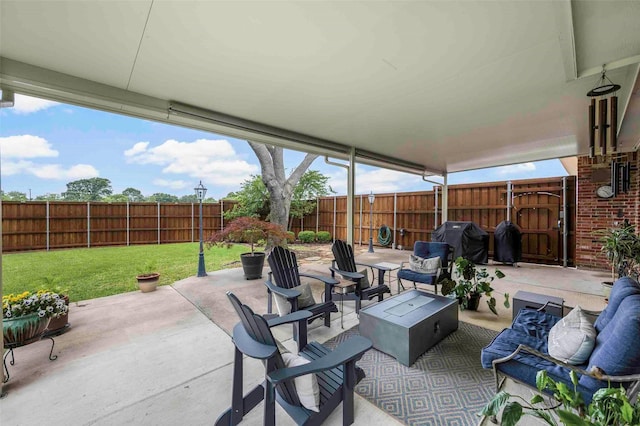 view of patio with a fenced backyard, an outdoor living space, and area for grilling