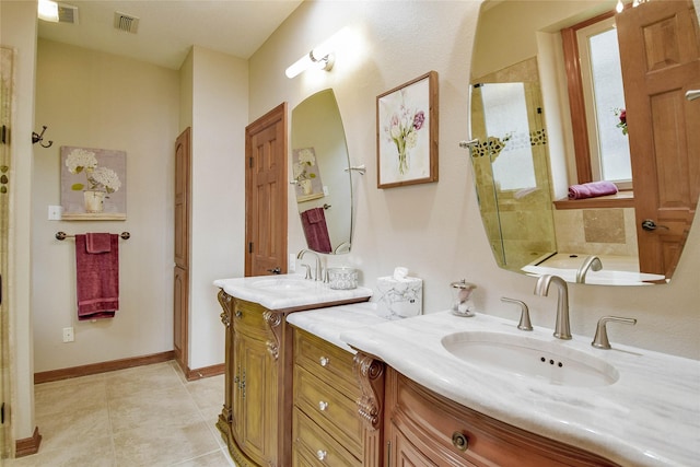 full bath with visible vents, two vanities, a sink, and tile patterned flooring