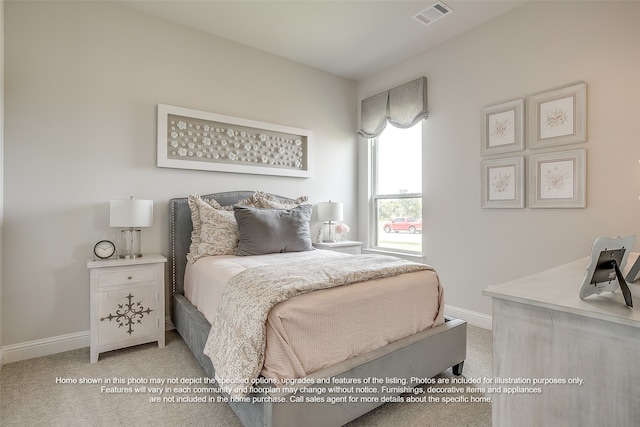 bedroom with light colored carpet, baseboards, and visible vents