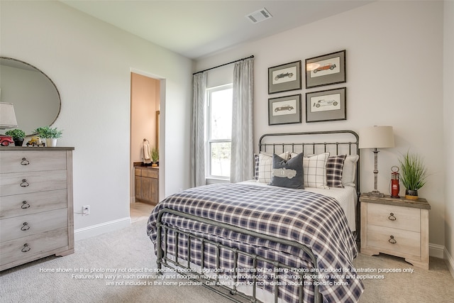 bedroom featuring baseboards, visible vents, ensuite bathroom, and light colored carpet