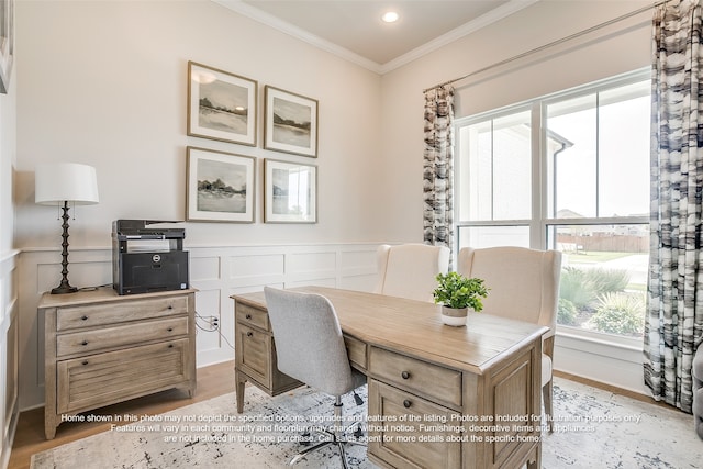 home office featuring crown molding, wainscoting, a decorative wall, light wood-style floors, and recessed lighting