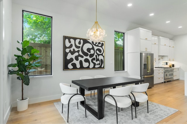 9409 Lenel Pl, Dallas, TX 75220 - dining space with plenty of natural light, light wood finished floors, a chandelier, recessed lighting, and baseboards