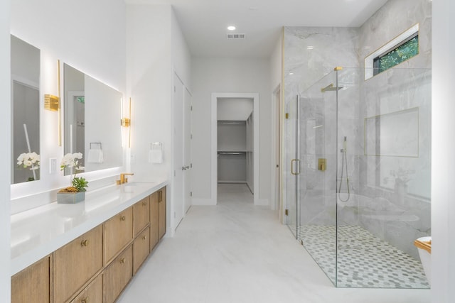 9409 Lenel Pl, Dallas, TX 75220 - bathroom with a stall shower, vanity, and a spacious closet