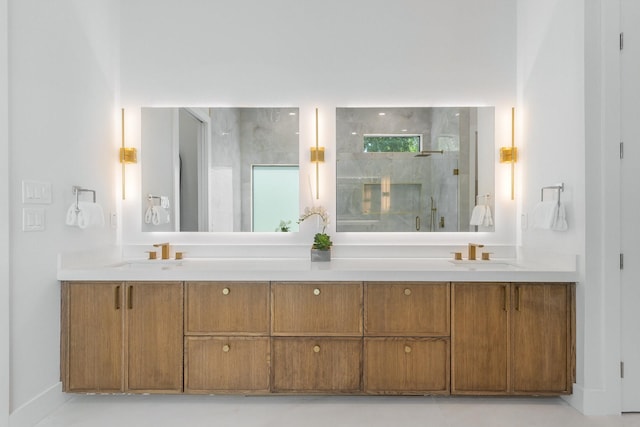 9409 Lenel Pl, Dallas, TX 75220 - full bath with a marble finish shower, double vanity, and baseboards