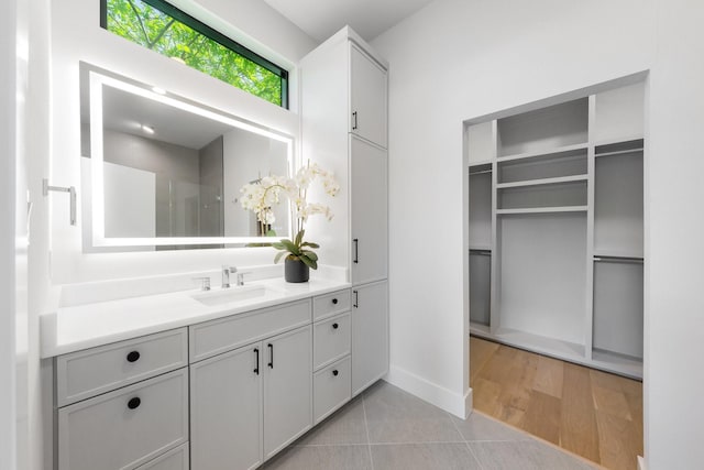 9409 Lenel Pl, Dallas, TX 75220 - full bath with vanity, tile patterned floors, and baseboards