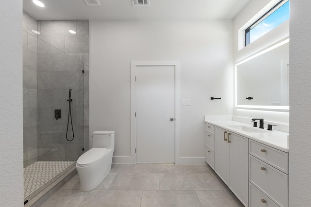 9409 Lenel Pl, Dallas, TX 75220 - full bath with toilet, tile patterned flooring, a tile shower, vanity, and baseboards