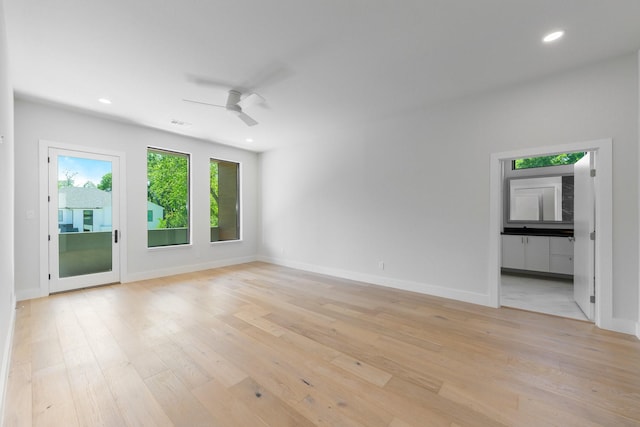 9409 Lenel Pl, Dallas, TX 75220 - unfurnished room featuring light wood-style flooring, a ceiling fan, recessed lighting, and baseboards