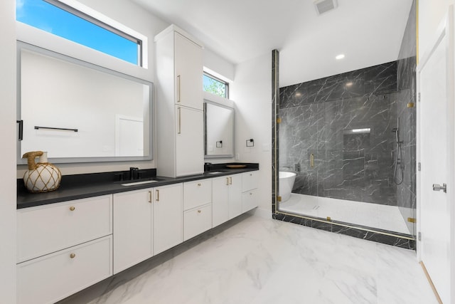 9409 Lenel Pl, Dallas, TX 75220 - bathroom featuring marble look tile flooring, double vanity, a marble finish shower, and a freestanding bath