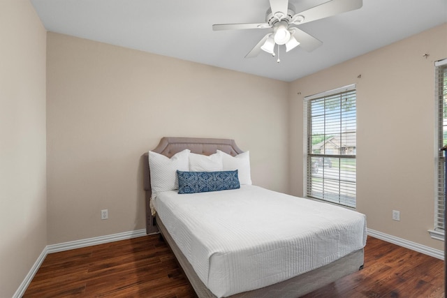 bedroom with baseboards, a ceiling fan, and wood finished floors