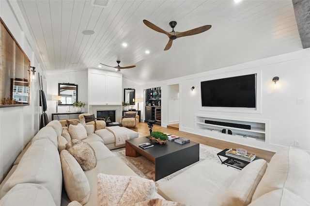 living room with recessed lighting, wood ceiling, built in shelves, a ceiling fan, and light wood-style flooring