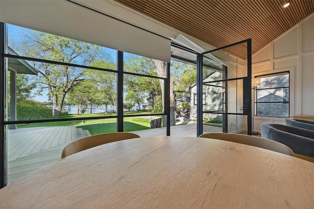 bedroom featuring vaulted ceiling and multiple windows