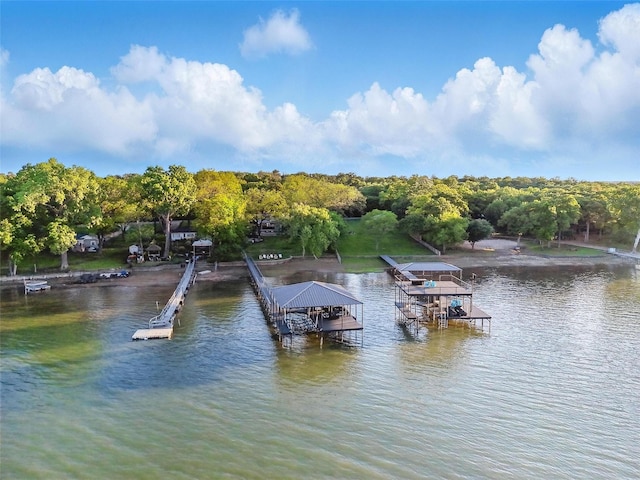 view of dock featuring boat lift and a water view