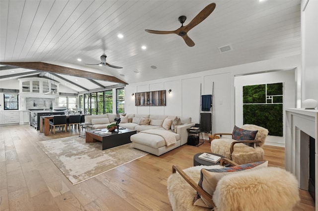 living area with wood ceiling, a ceiling fan, light wood finished floors, vaulted ceiling with beams, and recessed lighting